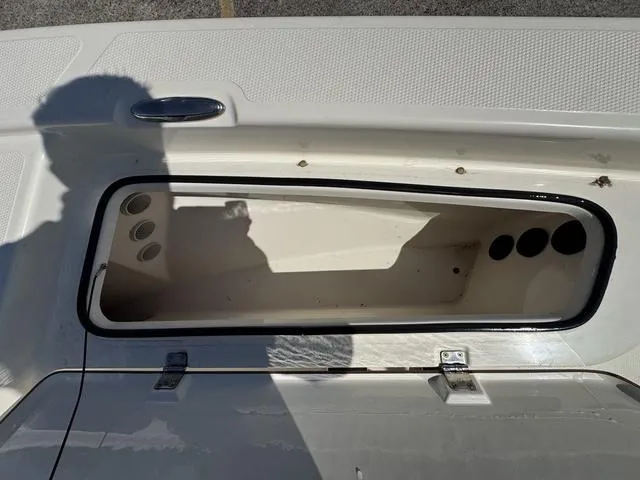 Slide: The Image of Open storage compartment on a 2014 Frontier Boats 2104, showing interior details. - 20