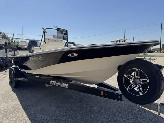 Slide: The Image of 2014 Frontier Boats 2104 on trailer, black and white design, parked outdoors. - 4