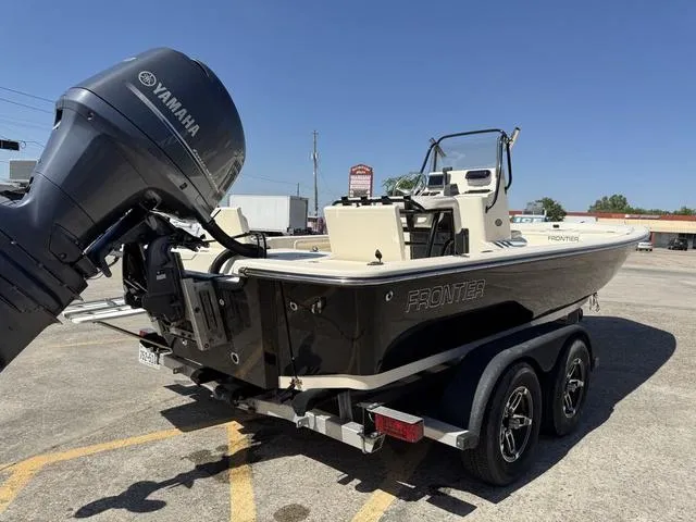Slide: The Image of 2014 Frontier Boats 2104 on trailer with Yamaha outboard motor in parking lot. - 7