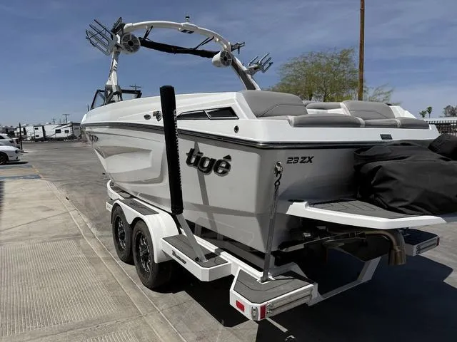 Slide: The Image of 2021 Tigé ZX Class 23 ZX boat on trailer, parked outdoors. - 6