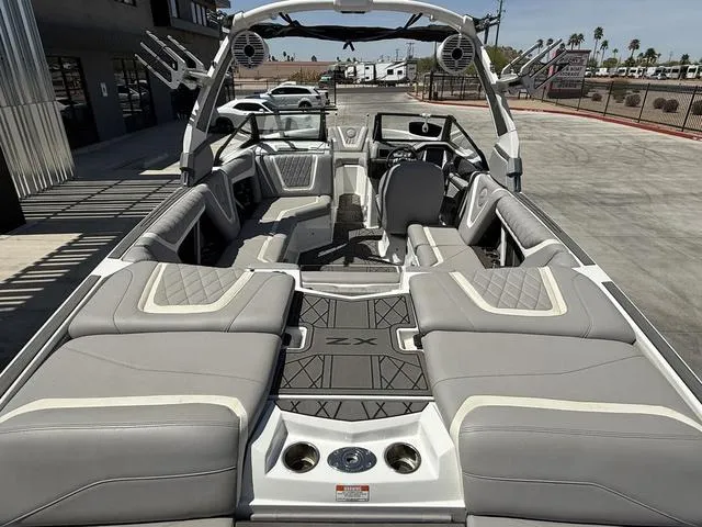 Slide: The Image of 2021 Tigé ZX Class 23 ZX boat interior with luxurious seating and modern design. - 9