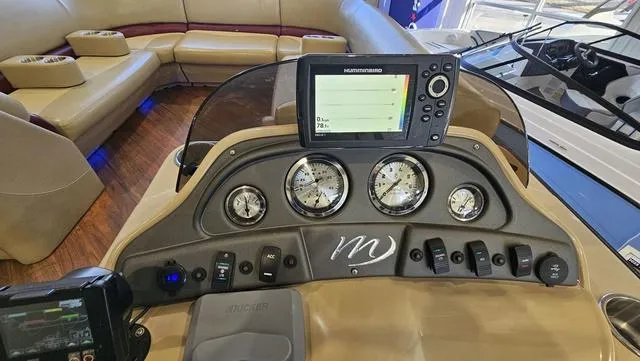 Slide: The Image of Dashboard of 2017 Manitou Aurora 25 LE boat with gauges and navigation system. - 21
