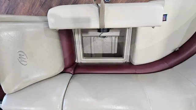 Slide: The Image of 2017 Manitou Aurora 25 LE boat seat with storage compartment, beige and maroon upholstery. - 28