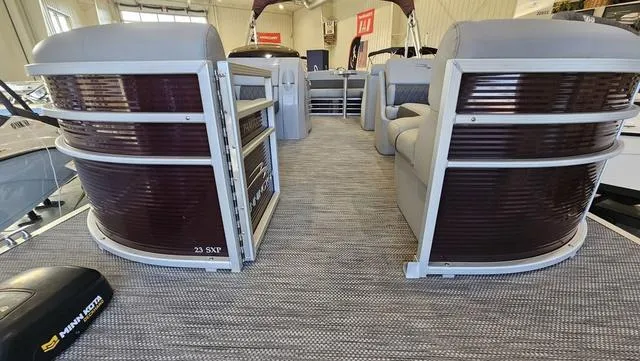 Slide: The Image of 2020 Bennington SX 23 Premium pontoon boat interior with plush seating and modern design. - 19