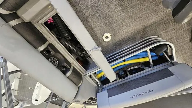 Slide: The Image of 2020 Bennington SX 23 Premium boat interior with storage compartments and seating. - 23