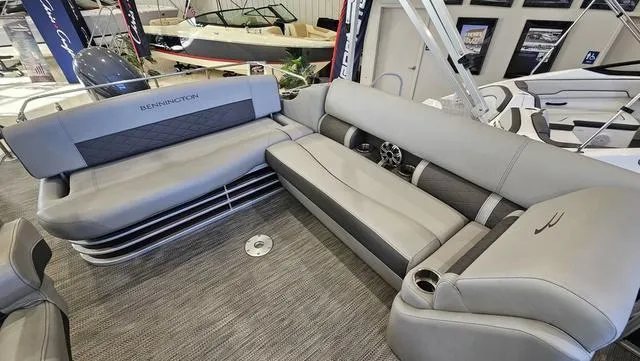 Slide: The Image of 2020 Bennington SX 23 Premium boat interior with luxurious gray seating. - 8