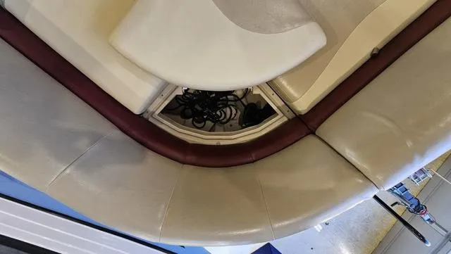 Slide: The Image of 2017 Manitou Aurora 25 LE boat interior seating with storage compartment. - 26