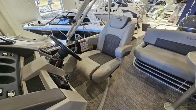 Slide: The Image of 2020 Bennington SX 23 Premium boat interior with captain's chair and dashboard. - 10