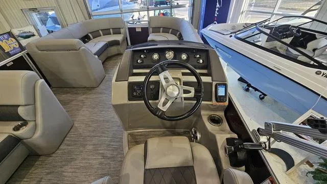 Slide: The Image of Interior view of 2020 Bennington SX 23 Premium pontoon boat with steering console. - 11