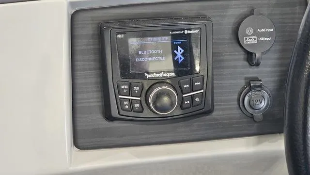 Slide: The Image of 2020 Bennington SX 23 Premium dashboard with Rockford Fosgate audio system, Bluetooth disconnected. - 13