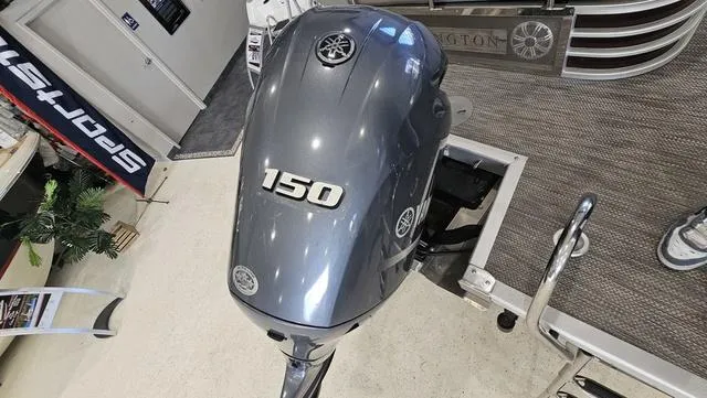 Slide: The Image of 2020 Bennington SX 23 Premium with Yamaha 150 outboard motor in showroom. - 28