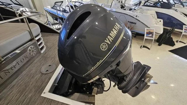 Slide: The Image of 2020 Bennington SX 23 Premium with Yamaha outboard motor in showroom. - 29