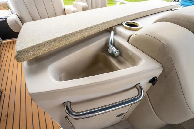 Slide: The Image of 2014 Bennington 2550 RBR boat interior with sink and countertop detail. - 20