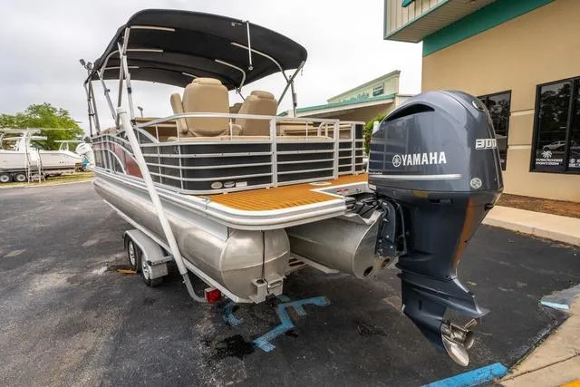 Slide: The Image of 2014 Bennington 2550 RBR pontoon boat with Yamaha engine, parked on a trailer. - 3