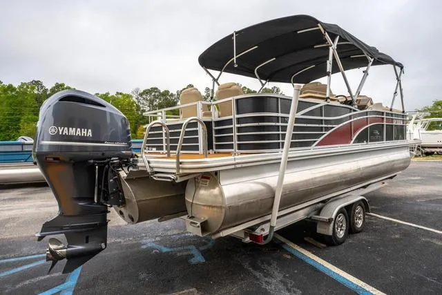 Slide: The Image of 2014 Bennington 2550 RBR pontoon boat with Yamaha outboard motor on trailer. - 5