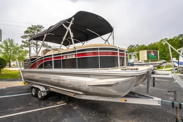 Slide: The Image of 2014 Bennington 2550 RBR pontoon boat on trailer, parked outdoors. - 7