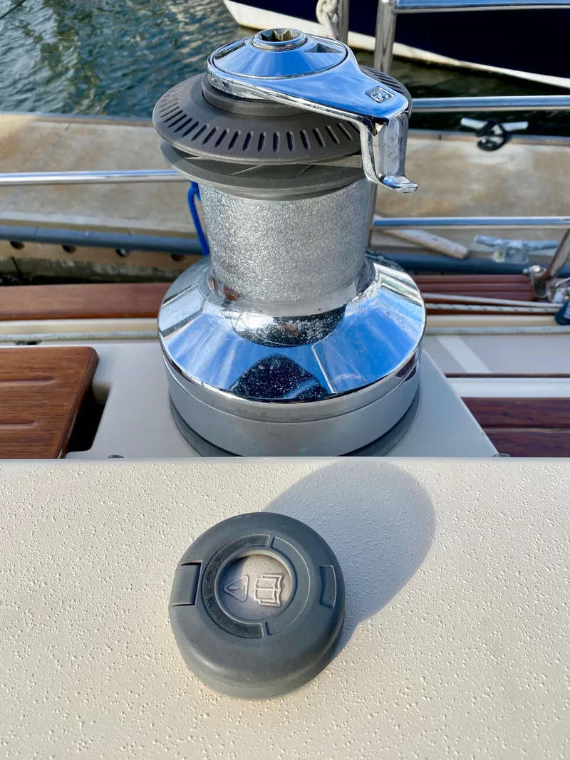 Slide: The Image of Winch and control button on 2006 Island Packet 485 Center Cockpit sailboat deck. - 17
