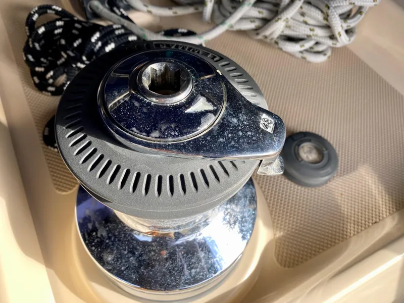 Slide: The Image of Winch on 2006 Island Packet 485 Center Cockpit sailboat, with ropes in background. - 18