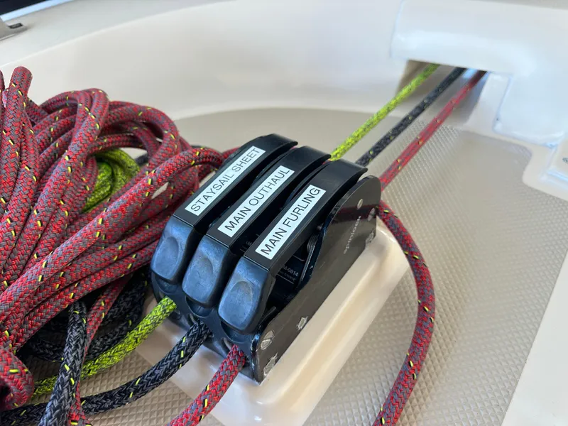 Slide: The Image of Rope clutches on 2006 Island Packet 485 Center Cockpit sailboat, labeled for sail control. - 20
