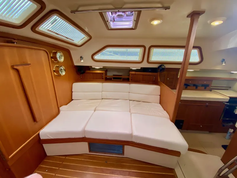 Slide: The Image of Luxurious interior of 2006 Island Packet 485 Center Cockpit yacht with plush seating. - 34