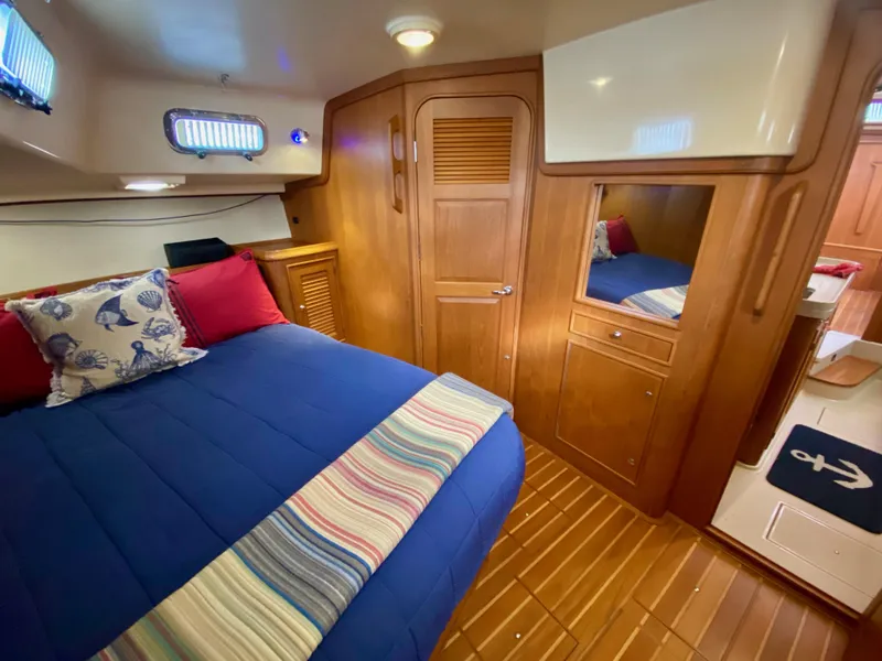 Slide: The Image of Luxurious cabin interior of 2006 Island Packet 485 Center Cockpit yacht with cozy bedding. - 47