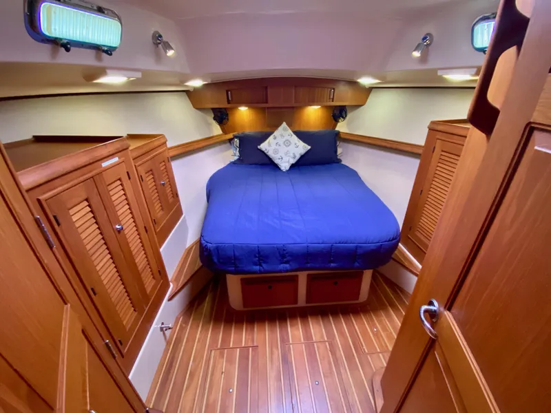 Slide: The Image of Luxurious cabin interior of 2006 Island Packet 485 Center Cockpit yacht with wood finish. - 53