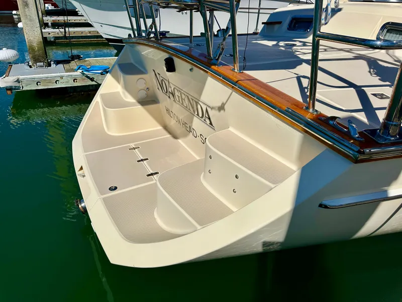 Slide: The Image of 2006 Island Packet 485 Center Cockpit yacht stern view with steps and railing. - 8