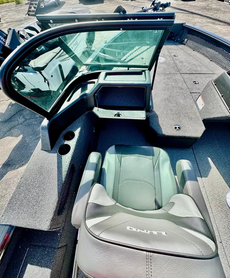 Slide: The Image of 2025 Lund 2075 IMPACT XS boat interior with seating and console. - 10