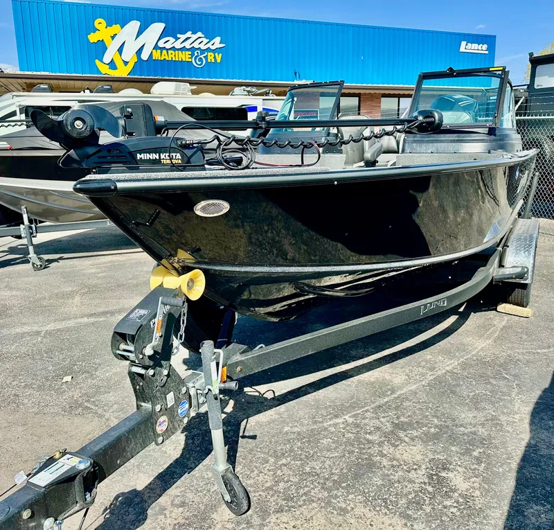Slide: The Image of 2025 Lund 2075 IMPACT XS boat on trailer at Mattas Marine & RV dealership. - 6