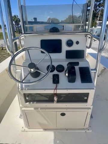 Slide: The Image of 2007 Jones Brothers 23 Bateau boat console with steering wheel and navigation instruments. - 7