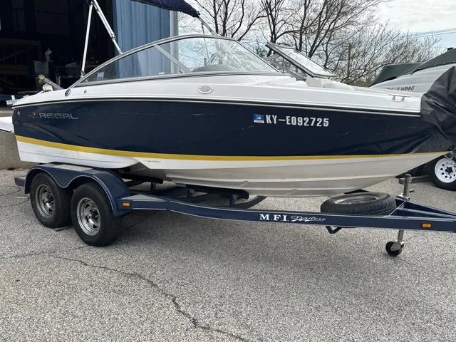 Slide: The Image of 2007 Regal Sport Boat 1900 Bowrider on trailer, parked outdoors. - 1