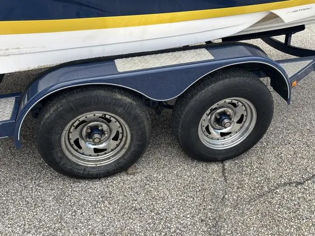 Slide: The Image of Trailer wheels of a 2007 Regal Sport Boat 1900 Bowrider on pavement. - 10