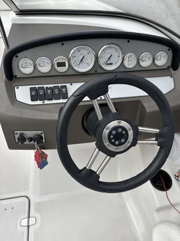 Slide: The Image of Steering wheel and dashboard of 2007 Regal Sport Boat 1900 Bowrider. - 11