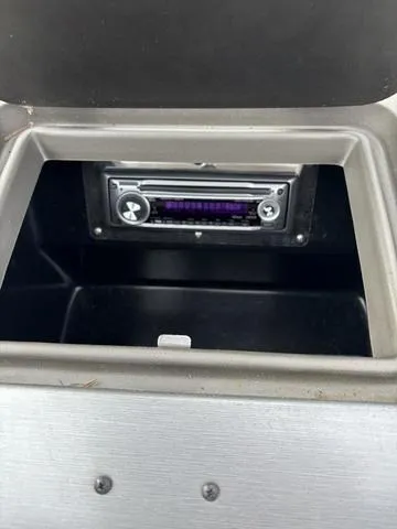 Slide: The Image of 2007 Regal Sport Boat 1900 Bowrider stereo system in storage compartment. - 12