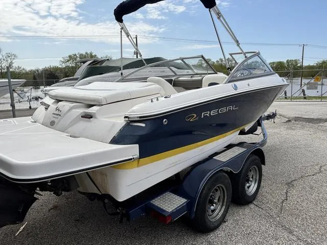 Slide: The Image of 2007 Regal Sport Boat 1900 Bowrider on trailer, parked outdoors. - 3