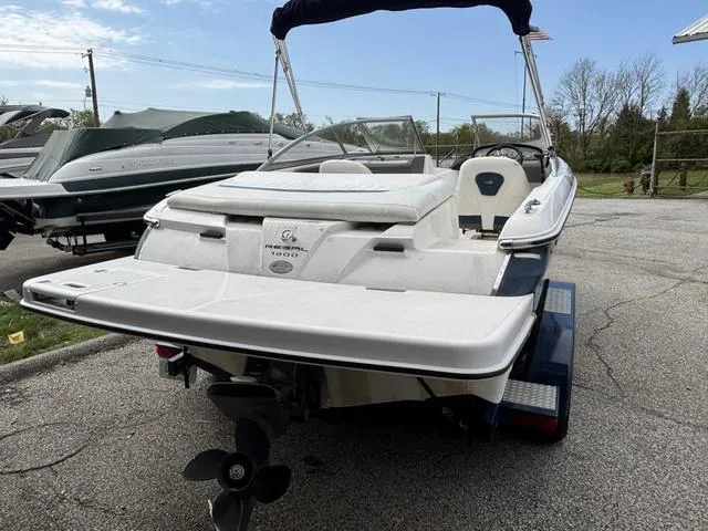 Slide: The Image of 2007 Regal Sport Boat 1900 Bowrider, white, parked on a trailer, rear view. - 4