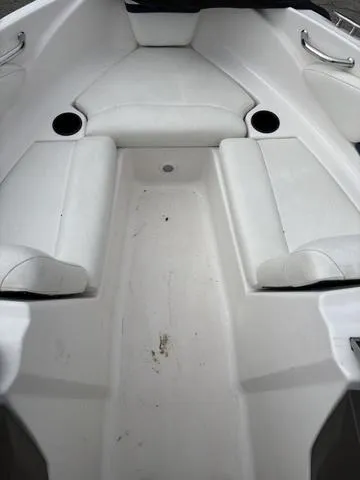 Slide: The Image of 2007 Regal Sport Boat 1900 Bowrider interior with white seating and cup holders. - 5