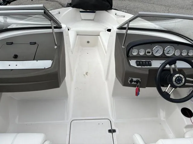 Slide: The Image of 2007 Regal Sport Boat 1900 Bowrider interior with steering wheel and dashboard controls. - 6