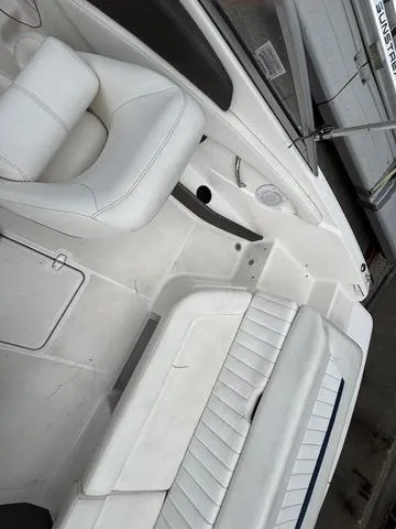 Slide: The Image of 2007 Regal Sport Boat 1900 Bowrider interior with white seating and sleek design. - 9