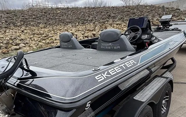 Slide: The Image of 2020 Skeeter ZX250 fishing boat with dual seats and advanced navigation equipment. - 12