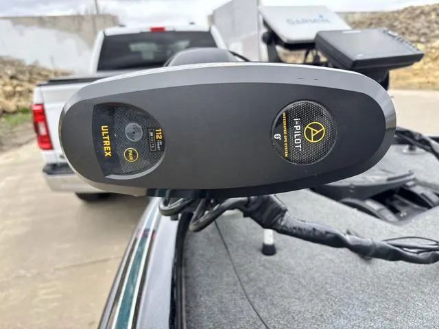 Slide: The Image of 2020 Skeeter ZX250 boat with Ultrex i-Pilot trolling motor, parked near a truck. - 14