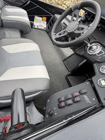 Slide: The Image of 2020 Skeeter ZX250 boat interior with steering wheel and control panel. - 15