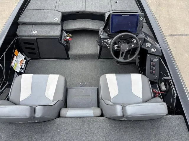 Slide: The Image of 2020 Skeeter ZX250 boat interior with dual seats and modern dashboard. - 21