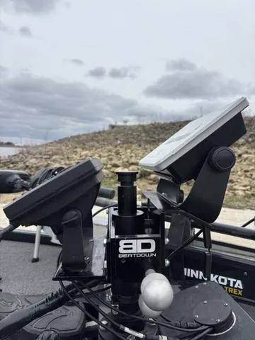 Slide: The Image of 2020 Skeeter ZX250 boat with advanced electronics and Minn Kota trolling motor, set against a cloudy sky. - 3