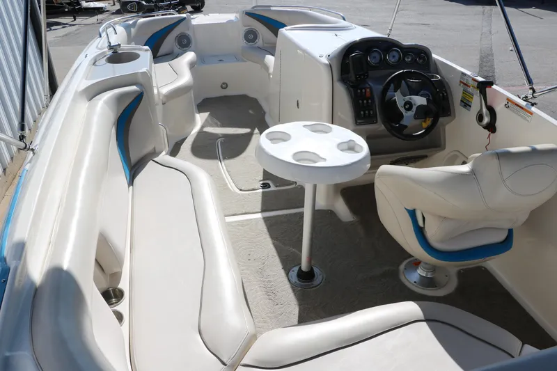 Slide: The Image of 2009 Hurricane FunDeck 226 OB boat interior with seating and steering console. - 13