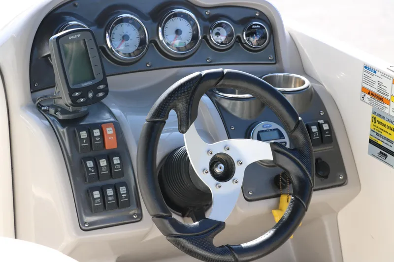 Slide: The Image of Dashboard of 2009 Hurricane FunDeck 226 OB boat with steering wheel and gauges. - 15