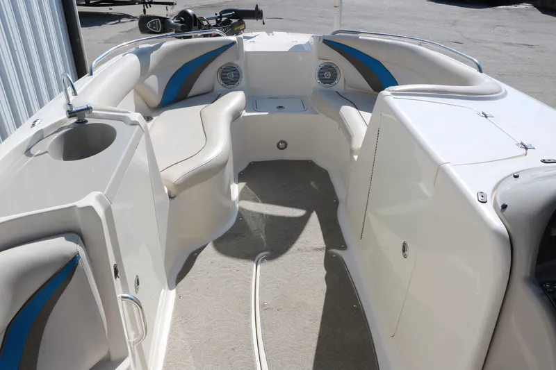 Slide: The Image of 2009 Hurricane FunDeck 226 OB interior with seating and storage compartments. - 18