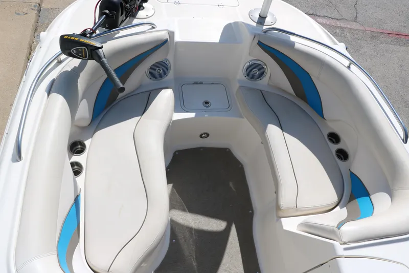 Slide: The Image of 2009 Hurricane FunDeck 226 OB boat interior with white and blue seating. - 22
