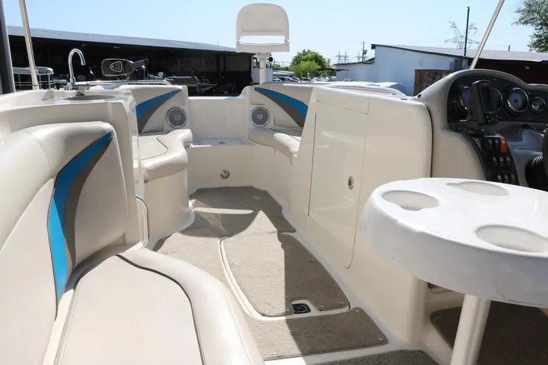 Slide: The Image of 2009 Hurricane FunDeck 226 OB interior with seating and table, showcasing spacious design. - 25
