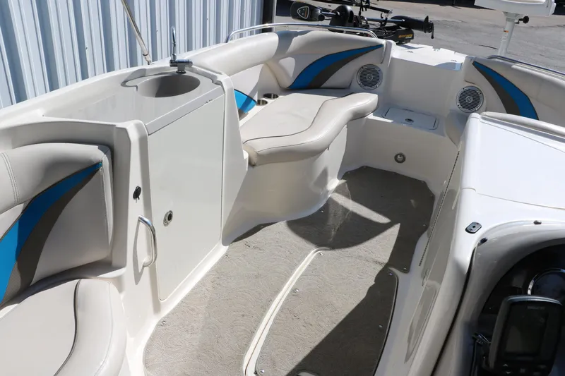 Slide: The Image of 2009 Hurricane FunDeck 226 OB interior with seating and sink, showcasing spacious design. - 26